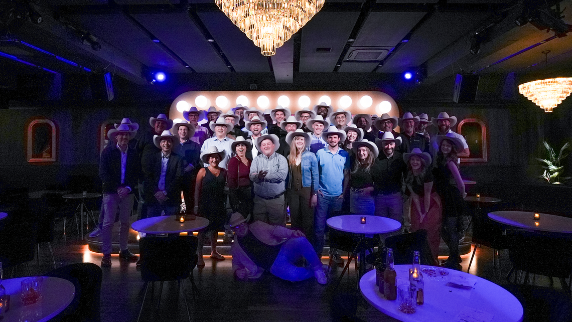 Campfire Talk attendees all together with their custom cowboy hats on