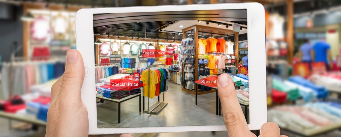 A view of a store through a tablet showing prices of various articles in the store