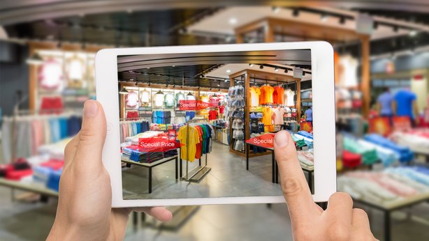 A view of a store through a tablet showing prices of various articles in the store