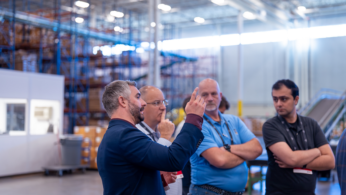 Campfire Talk attendees talking together at the Gap automated distribution center