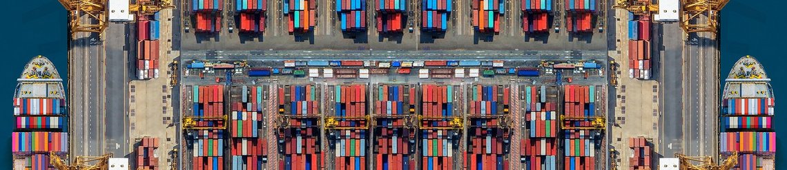 An overview of a lot of shipping containers on a dock