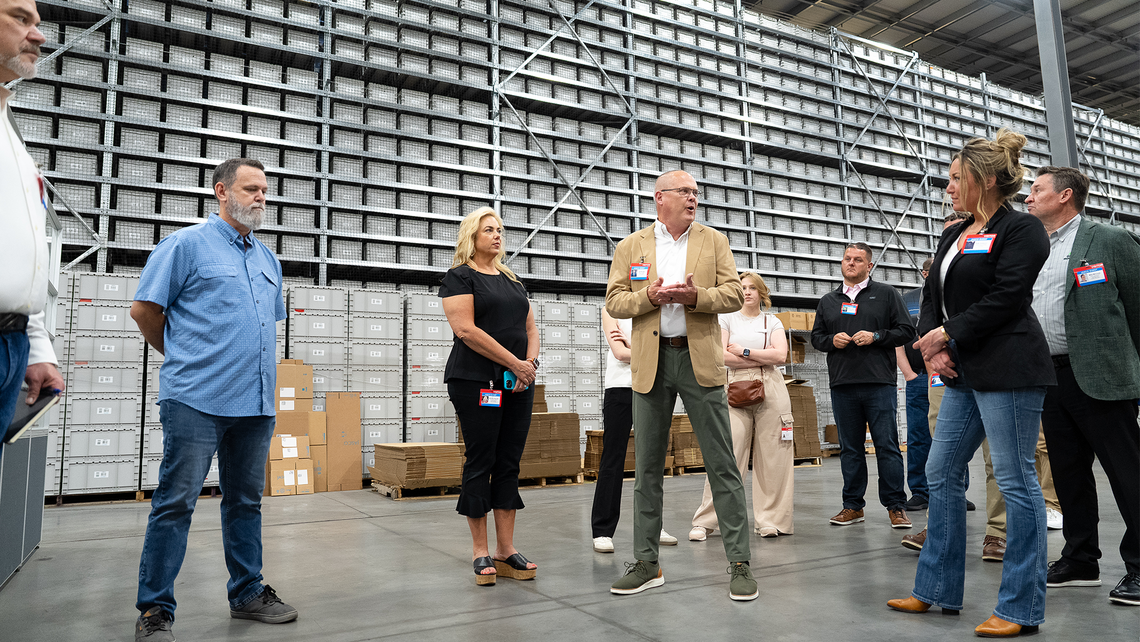 Attendees of Campfire Talk at Jasco discussing the warehouse automation technologies they've seen so far