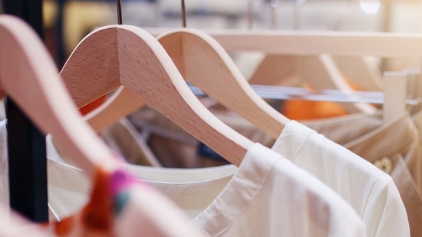 Clothes rail with multiple woman clothes hanging on it