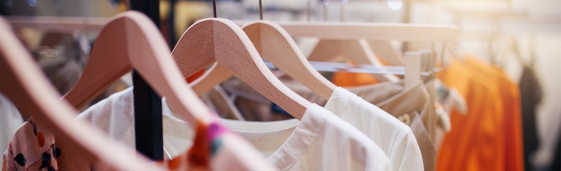 Clothes rail with multiple woman clothes hanging on it
