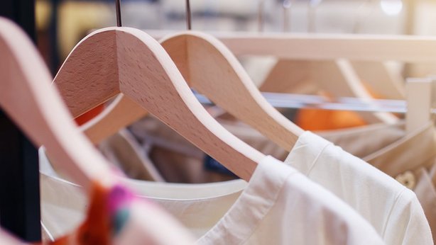Clothes rail with multiple woman clothes hanging on it