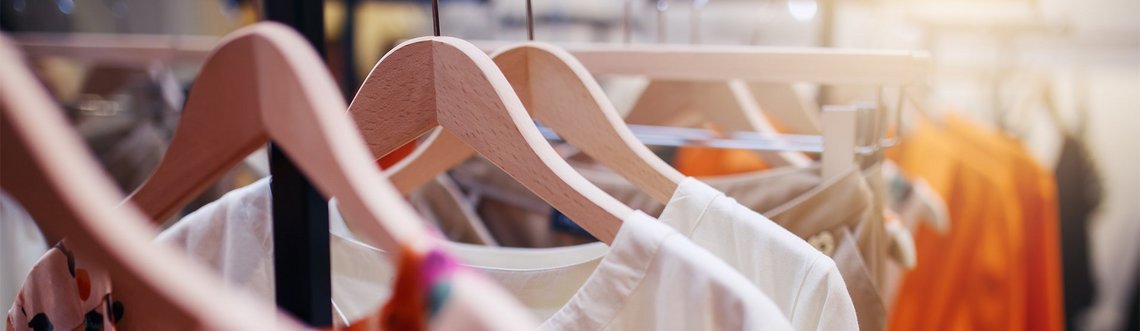 Clothes rail with multiple woman clothes hanging on it