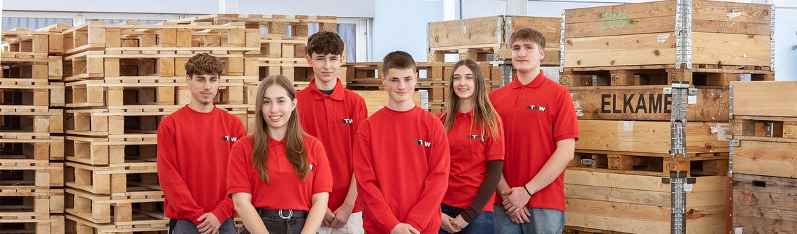 A group picture of all the TGW Logistics group apprentices with red t-shirts