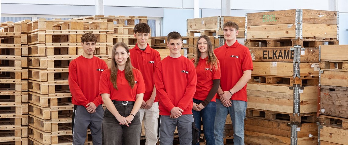 A group picture of all the TGW Logistics group apprentices with red t-shirts