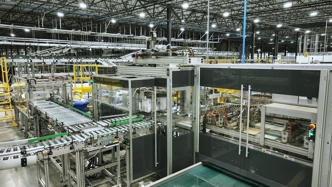 Fully automated packaging machine creating right size packaging - integrated by TGW Logistics for URBN