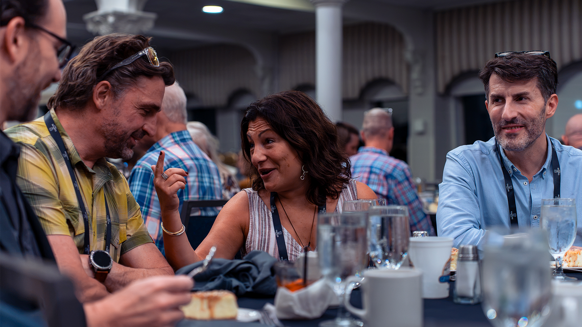 Campfire Talk attendees smiling and talking together on the General Jackson showboat river cruise