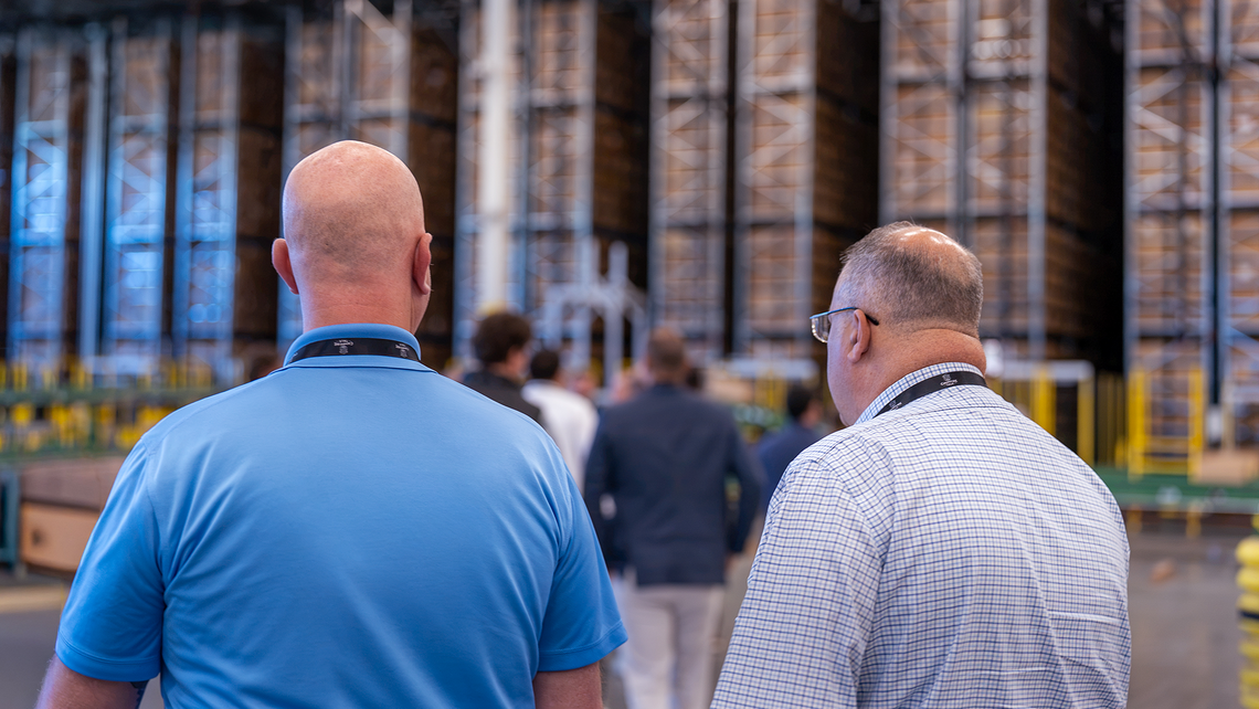 Campfire Talk attendees walking through the Gap automated distribution center