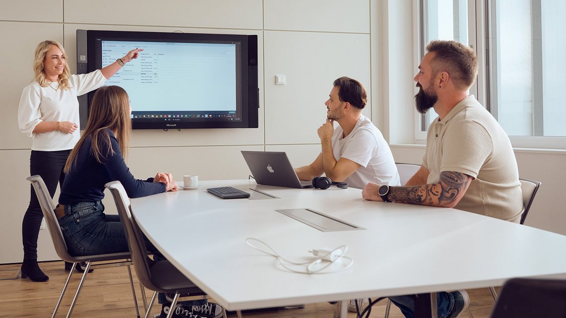 A corporate presentation given by a woman working for TGW Logistics