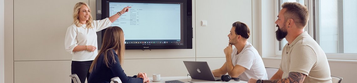 A corporate presentation given by a woman working for TGW Logistics