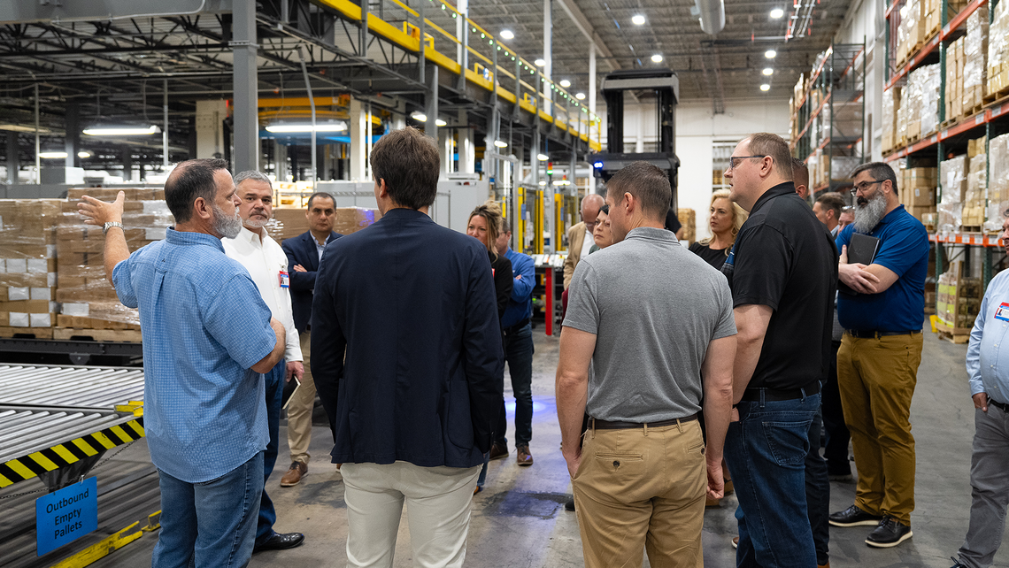 Attendees of Campfire Talk at Jasco learn about the flow of the warehouse and the role of material handling automation