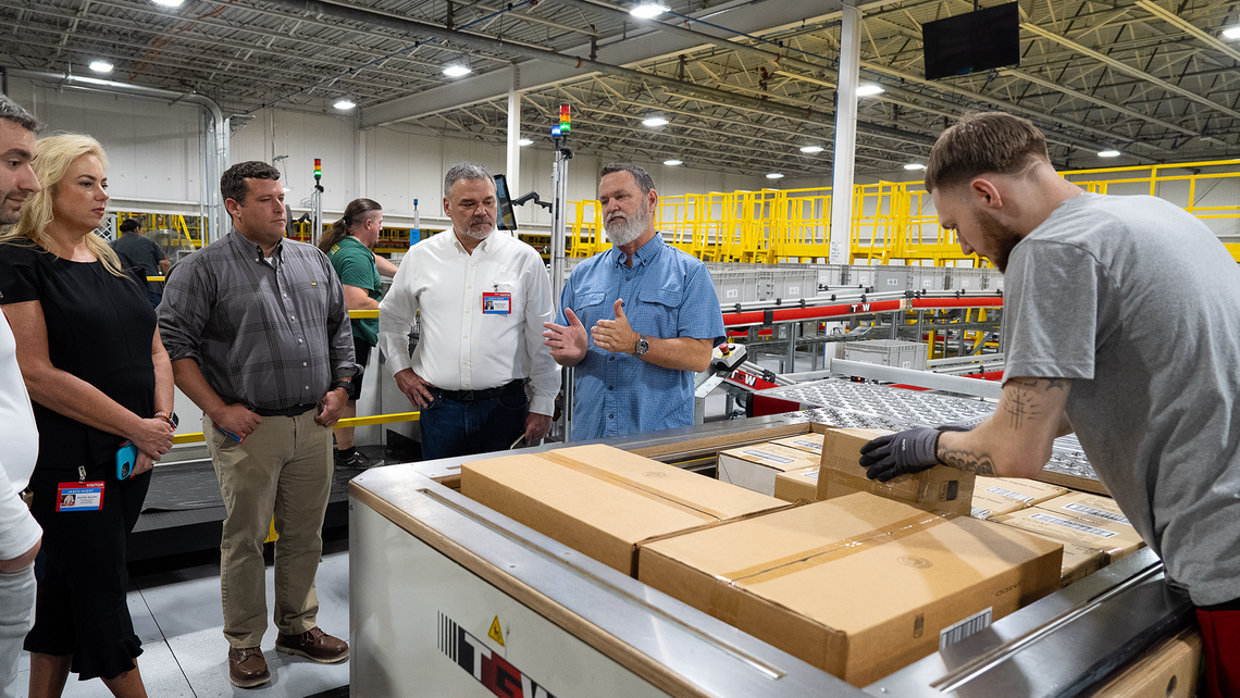 Attendees of Campfire Talk at Jasco learn about the ErgoStax palletizing system