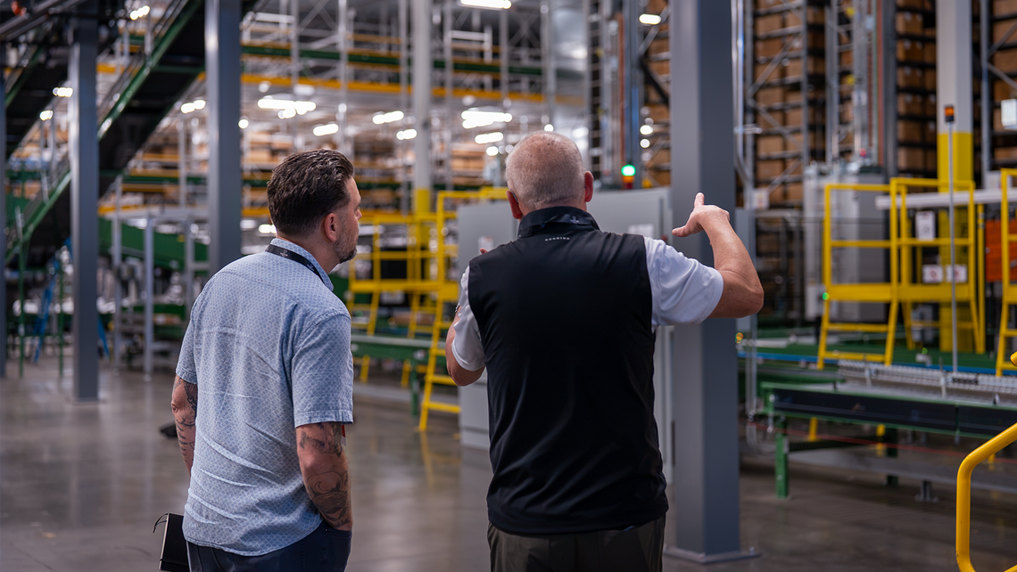 Campfire Talk attendees talking together at the Gap automated distribution center