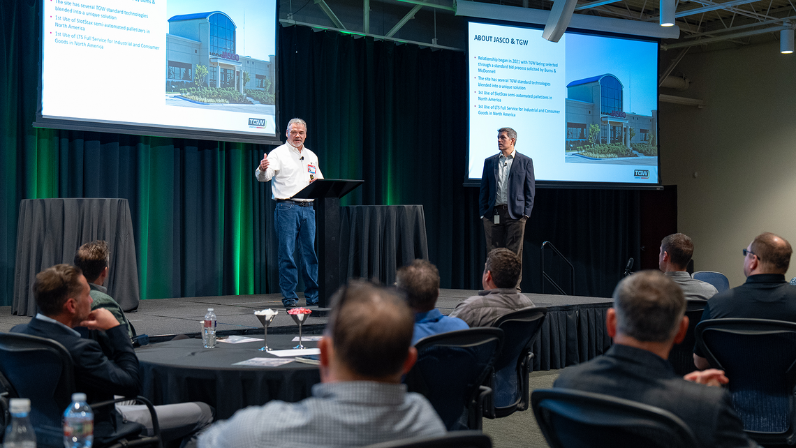 Attendees of Campfire Talk at Jasco listen to TGW Logistics and Jasco share their story about the solution and partnership