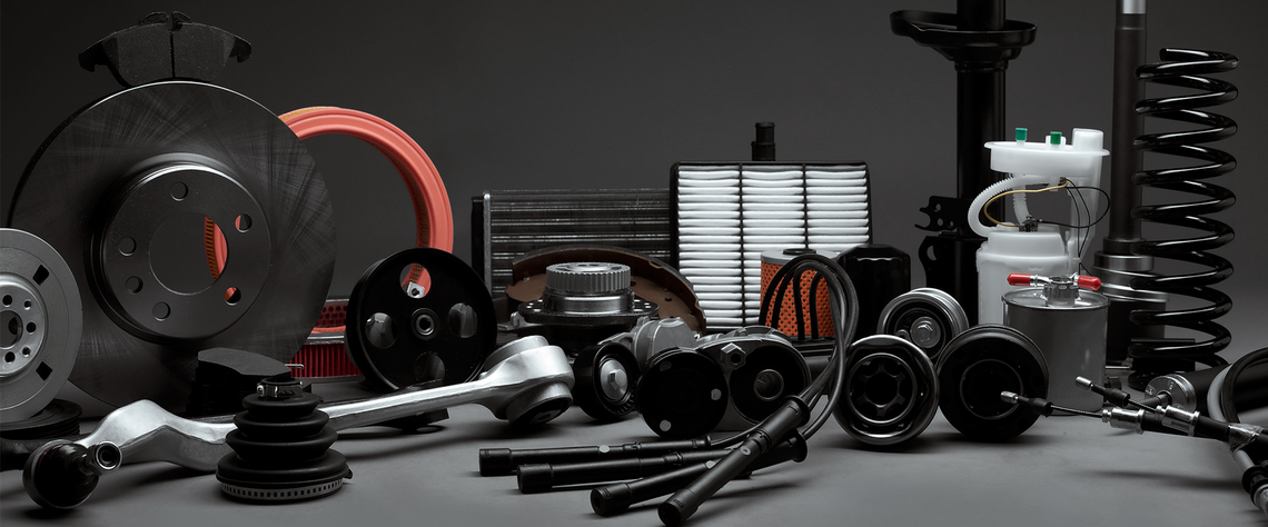 Automotive spare parts displayed nicely on a flat surface with a black background