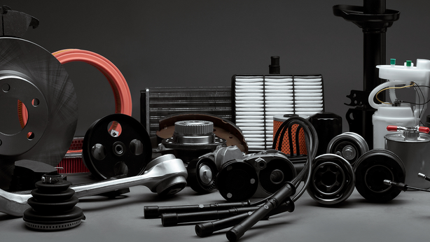 Automotive spare parts displayed nicely on a flat surface with a black background